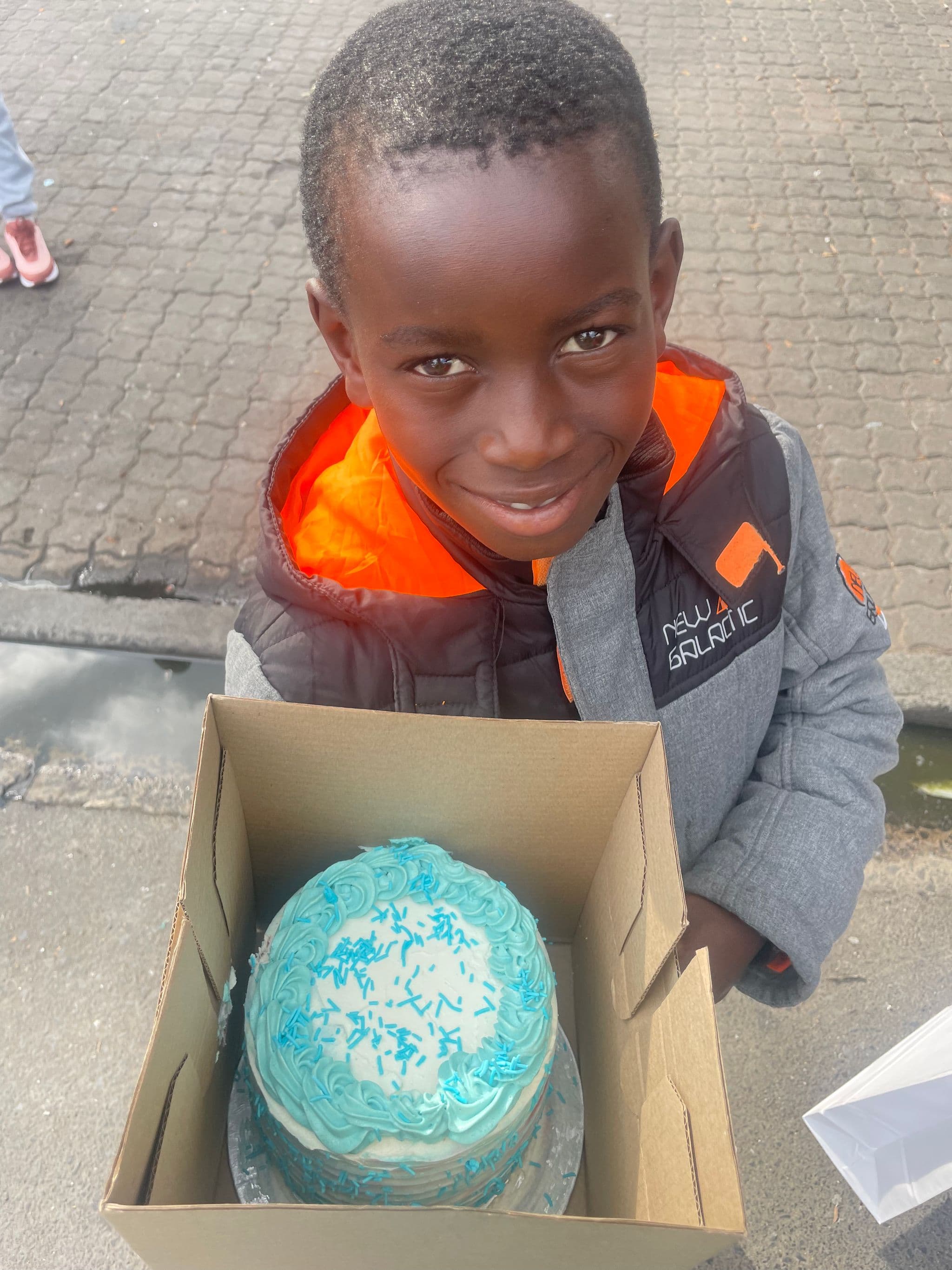 Lolwam with his birthday cake made by Tama